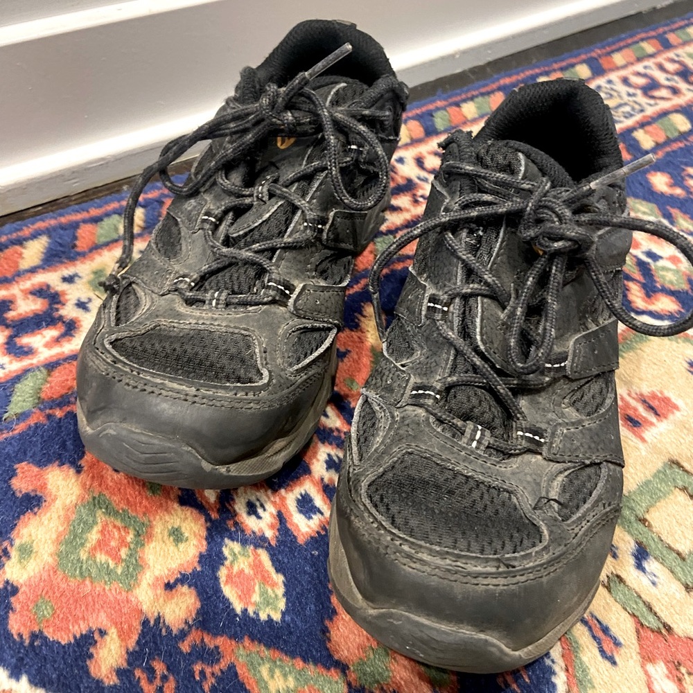 Size 4 Merrell kids outdoor shoe/ hiking boot, perfect for winter weather.
